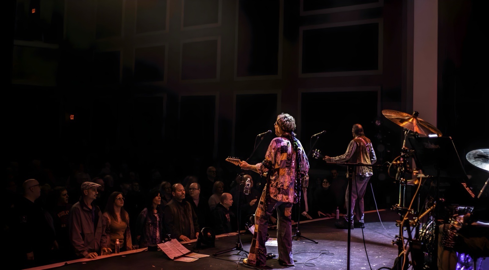 The British Invasion Years — stage behind band audience wide